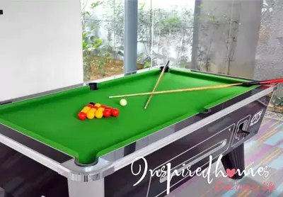 a pool table with balls and cues on it at Inspired Homes @ Summer Suite in Kuala Lumpur