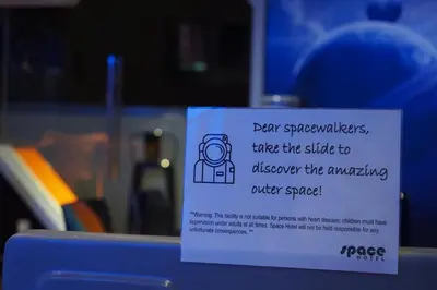 a sign that is on a window with a machine at Space Hotel @ Chinatown Kuala Lumpur in Kuala Lumpur