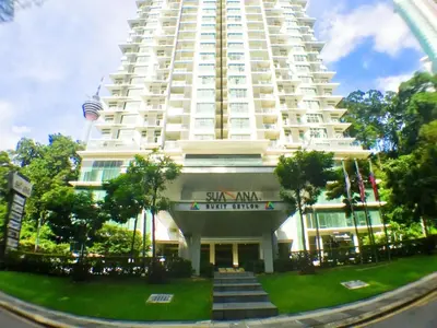 a large white building with stairs in front of it at Suasana Bukit Ceylon Residence in Kuala Lumpur
