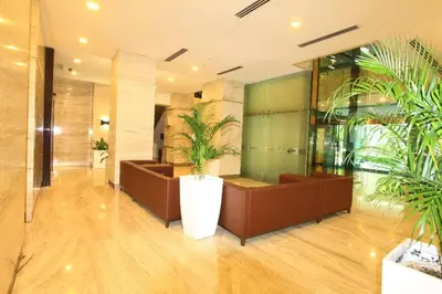 a lobby with some plants in a building at Suasana Bukit Ceylon Residence in Kuala Lumpur
