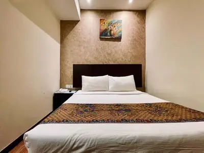 a bedroom with a large bed in a room at My Hotel @ Bukit Bintang in Kuala Lumpur