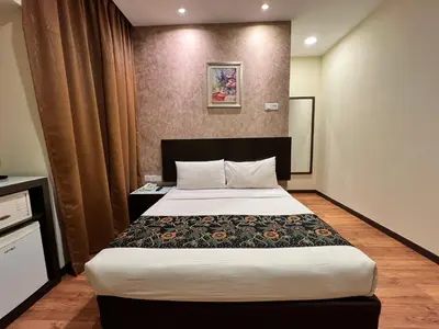 a bedroom with a large bed in a room at My Hotel @ Bukit Bintang in Kuala Lumpur
