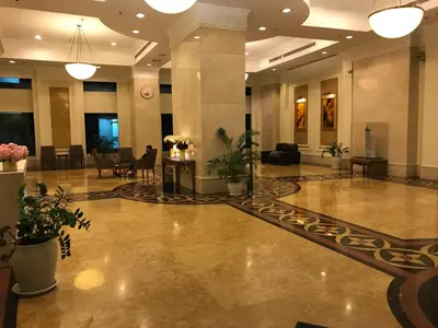 a lobby of a hotel with tables and chairs at Parkview KLCC in Kuala Lumpur