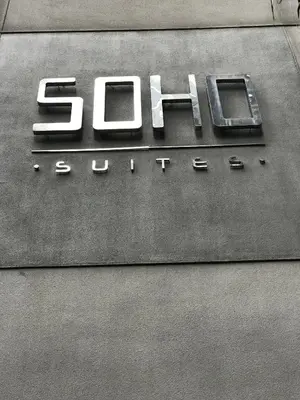 a gas station sign on the side of a building at Inspired Homes @ KLCC Soho Suite in Kuala Lumpur