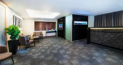 a lobby with a television and a waiting room at Fahrenheit Suites Bukit Bintang, Kuala Lumpur in Kuala Lumpur