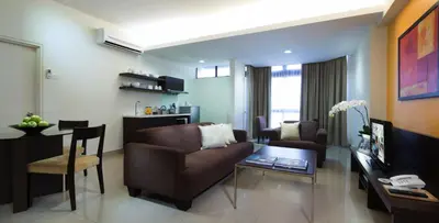 a living room with a couch and a table at Fahrenheit Suites Bukit Bintang, Kuala Lumpur in Kuala Lumpur
