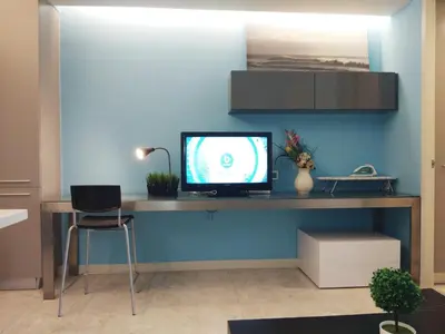 a room with a desk with a television on it at The Signature Serviced Suites Kuala Lumpur in Kuala Lumpur