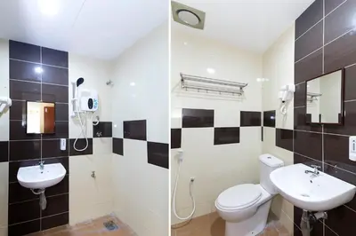 a bathroom with a toilet and a sink at Hotel Raja Bot in Kuala Lumpur