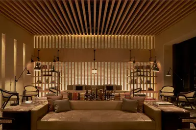 a living room with a couch and a table at The RuMa Hotel and Residences in Kuala Lumpur