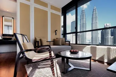 a living room with a couch and a table at The RuMa Hotel and Residences in Kuala Lumpur