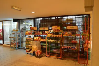 a grocery store aisle with a display of food at The Forum Condominium by LaFabrica in Kuala Lumpur