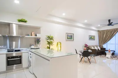 a kitchen and living room with a counter top at Mcity Jalan Ampang in Kuala Lumpur