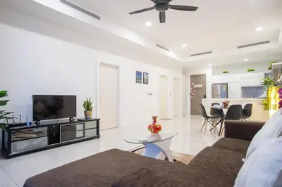 a living room with a couch and a tv at Mcity Jalan Ampang in Kuala Lumpur