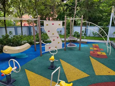 a childrens playground with a rock wall and a slide at Holiday Paradise in Kuala Lumpur