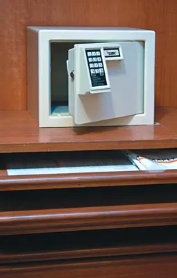 a microwave oven sitting on top of a shelf at The Maple Suite in Kuala Lumpur