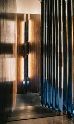 a hallway of a building with a wooden wall at Expressionz Professional Suites by MyKey in Kuala Lumpur