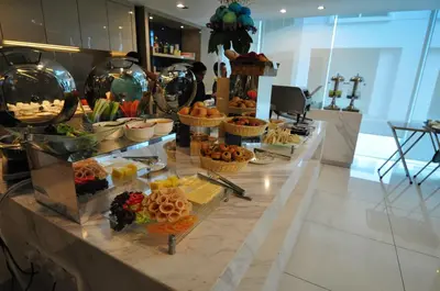 a buffet of food on a counter in a room at Damas Suites & Residences Kuala Lumpur in Kuala Lumpur