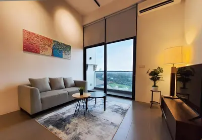 a living room with a couch and a table at KL Sentral, EST Bangsar by SkyLimit Suites in Kuala Lumpur