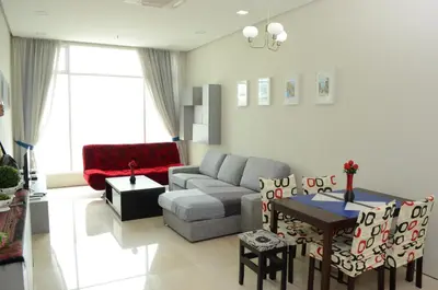 a living room with a couch and a table at Soho Suites KLCC by Elite in Kuala Lumpur