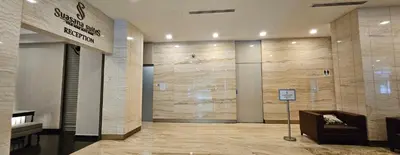 a lobby of a building with a sign on the wall at 3 Bedroom Cozy apartmet in Kuala Lumpur