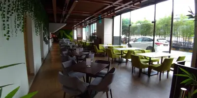a row of tables and chairs in a restaurant at Imperial Regency Suites & Kuala Lumpur in Kuala Lumpur