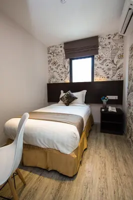 a bedroom with a large bed and a window at Double M Hotel @ Kl Sentral in Kuala Lumpur