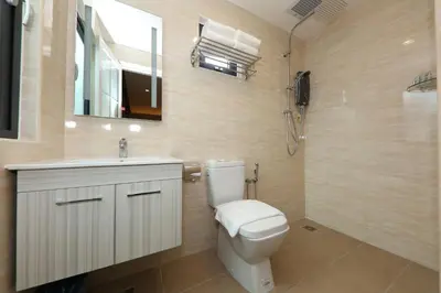 a bathroom with a toilet and a sink and a shower at Double M Hotel @ Kl Sentral in Kuala Lumpur