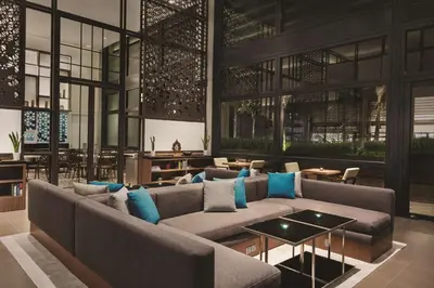 a living room with a couch and a table at Hyatt House Kuala Lumpur, Mont Kiara in Kuala Lumpur