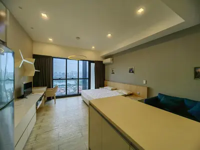 a hotel room with a bedroom with a bed and a desk at M CITY Kl City in Kuala Lumpur