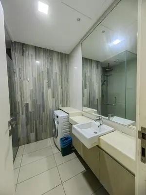 a bathroom with a sink and a large mirror at M CITY Kl City in Kuala Lumpur