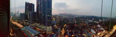 a view of a city with a tall building at Charming Bedroom - next to train station at Est Bangsar in Kuala Lumpur