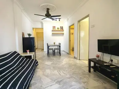 a living room with a bed and a ceiling fan at Setapak TerataiMewahApart to15min KLCC 217 in Kuala Lumpur