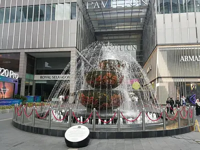 a water fountain in front of a building at Fahrenheit 88 Pavillion Bukit Bintang Street AJ-HOME in Kuala Lumpur