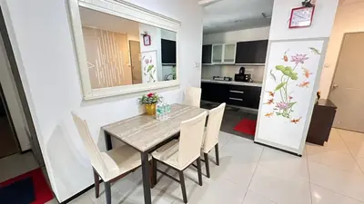a kitchen and dining room with a table and chairs at Taragon Service Apartment- Next To LaLaport BBCC in Kuala Lumpur