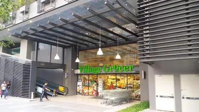 a store front of a building with people walking outside at M City Center Jalan Ampang Lakeview KLCC KL Tower Merdeka 118 TRX in Kuala Lumpur