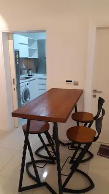 a wooden table and two chairs in a kitchen at M City Center Jalan Ampang Lakeview KLCC KL Tower Merdeka 118 TRX in Kuala Lumpur