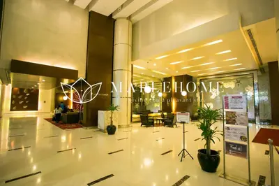 a lobby of a building with a sign that reads akhtar at SG Residence Kuala Lumpur in Kuala Lumpur