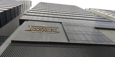 a sign on the side of a tall building at Imperial Regency Suites & Petaling Jaya in Kuala Lumpur