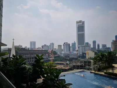 a view of a city skyline with a swimming pool at Robertson Suites Kuala Lumpur in Kuala Lumpur