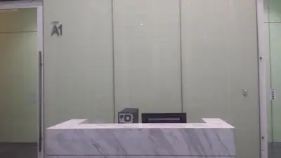 a room with a mirror and a clock on a table at Soho Suites KL City Centre in Kuala Lumpur
