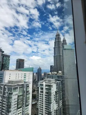 a view of a city skyline with tall buildings at Soho Suites KL City Centre in Kuala Lumpur