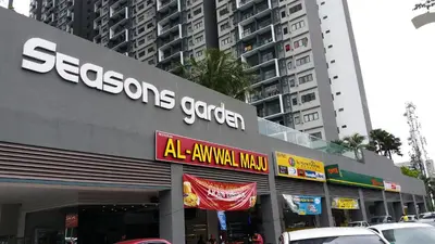 a store with a sign for a car dealership at Adna Homestay Wangsa Maju in Kuala Lumpur