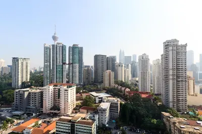 a city skyline with tall buildings in a city at Robertson Suites by Airhost in Kuala Lumpur