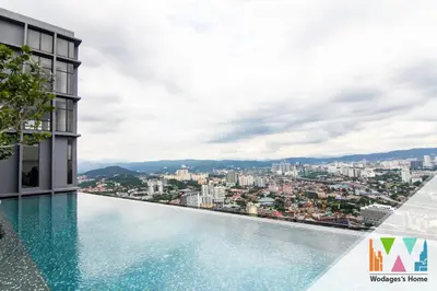 a swimming pool on top of a building with a city at Expressionz KLCC by Wodages in Kuala Lumpur