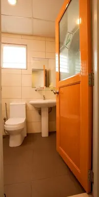 a bathroom with a toilet and a sink at LEO Express Hotel in Kuala Lumpur