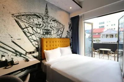 a hotel room with a bed and a window at Travelodge Kuala Lumpur City Centre in Kuala Lumpur