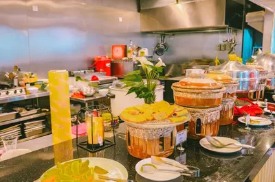 a kitchen with many jars of food on a counter at Travelodge Kuala Lumpur City Centre in Kuala Lumpur