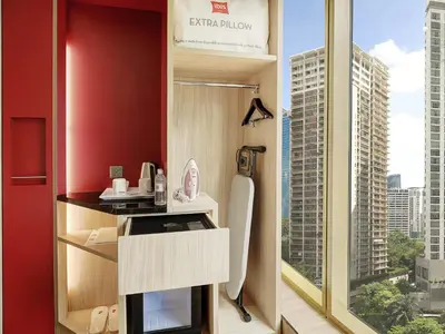 a bathroom with a shower with a view of a city at ibis Kuala Lumpur City Centre in Kuala Lumpur