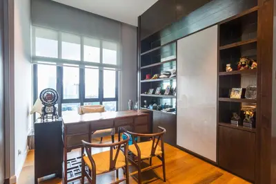 a kitchen with a bar with two chairs and a window at KLCC Luxury Condo Damai 88 Near Gleneagles Hospital in Kuala Lumpur