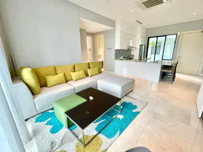 a living room with a couch and a table at KLCC Luxury Condo Damai 88 Near Gleneagles Hospital in Kuala Lumpur